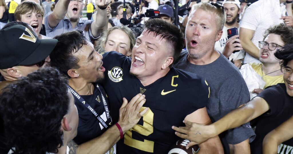 Oct 5, 2024; Nashville, Tennessee, USA; Vanderbilt Commodores quarterback Diego Pavia celebrates with fans after defeating the Alabama Crimson Tide at FirstBank Stadium. Mandatory Credit: Butch Dill-Imagn Images