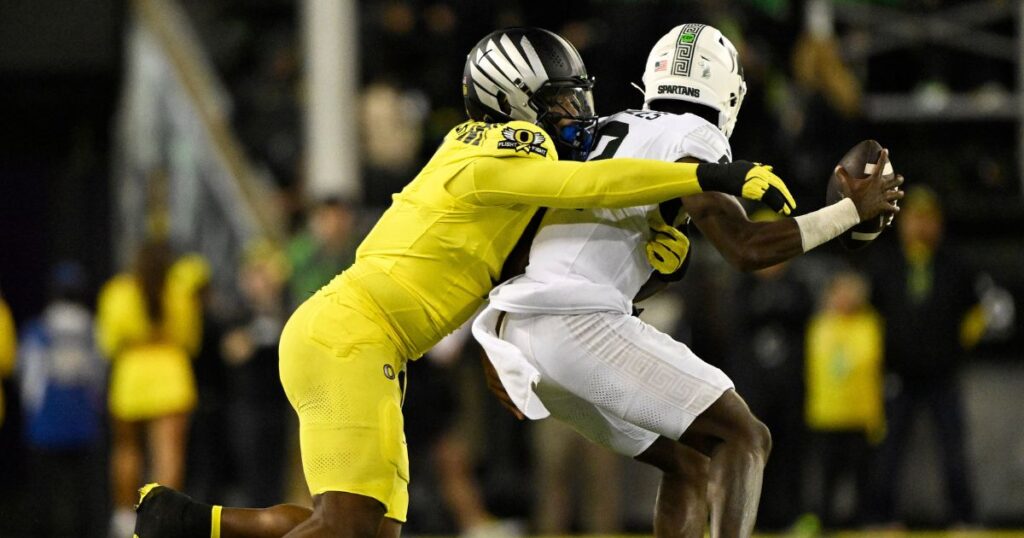 Oregon defensive end Jordan Burch sacks Michigan State quarterback Aidan Chiles during a 31-10 win in Week 6. (Troy Wayrynen-Imagn Images)