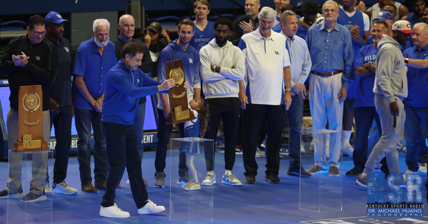 Rick Pitino places the 1996 championship trophy on a pedestal at Mark Pope's first Big Blue Madness as Kentucky's coach - Dr. Michael Huang, Kentucky Sports Radio