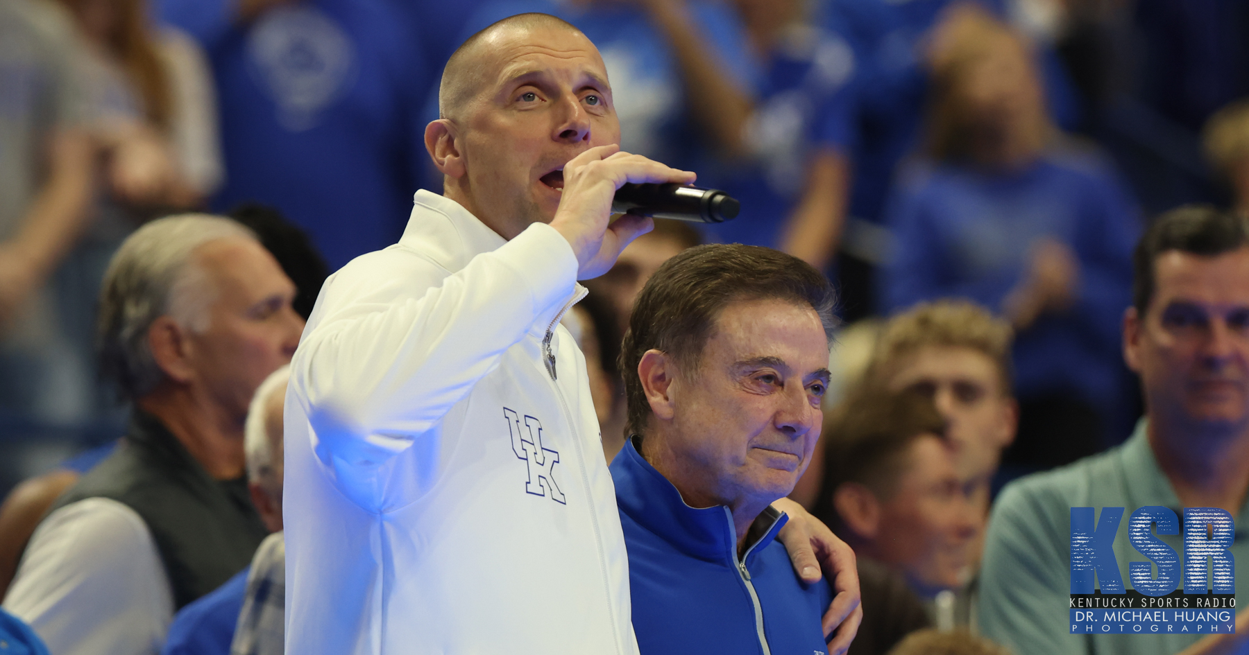 Mark Pope embraces Rick Pitino as he addresses the crowd at Rupp Arena for his first Big Blue Madness as Kentucky's head coach - Dr. Michael Huang, Kentucky Sports Radio