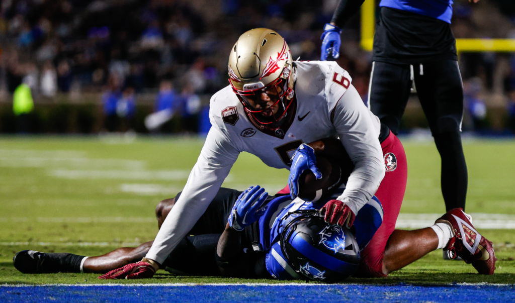 Duke Blue Devils quarterback Maalik Murphy (6) attempts to run the ball to the end zone but is tacked by Florida State Seminoles defensive lineman Darrell Jackson Jr. (6) during the first half of the game at Wallace Wade Stadium. (Jaylynn Nash-Imagn Images)