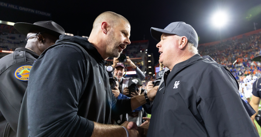 Oct 19, 2024; Gainesville, Florida, USA; Florida Gators head coach Billy Napier and Kentucky Wildcats head coach Mark Stoops shake hands after the game at Ben Hill Griffin Stadium. Mandatory Credit: Matt Pendleton-Imagn Images