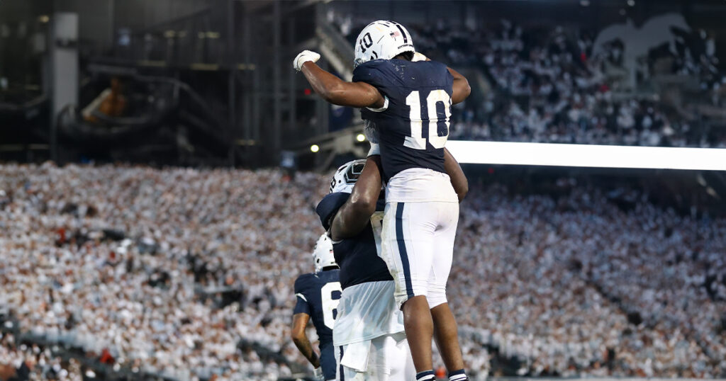 Penn State Nittany Lions running back Nicholas Singleton (10) celebrates with offensive linesman Anthony Donkoh (68) after a touchdown during the third quarter against the Illinois Fighting Illini at Beaver Stadium. Penn State defeated Illinois 21-7. Mandatory Credit: Matthew O'Haren-Imagn Images