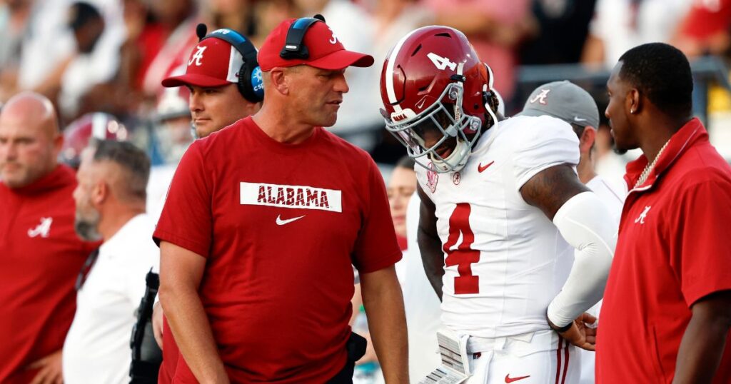 Alabama head coach Kalen DeBoer talks with quarterback Jalen Milroe during a 40-35 loss to Vanderbilt. (Butch Dill-Imagn Images)