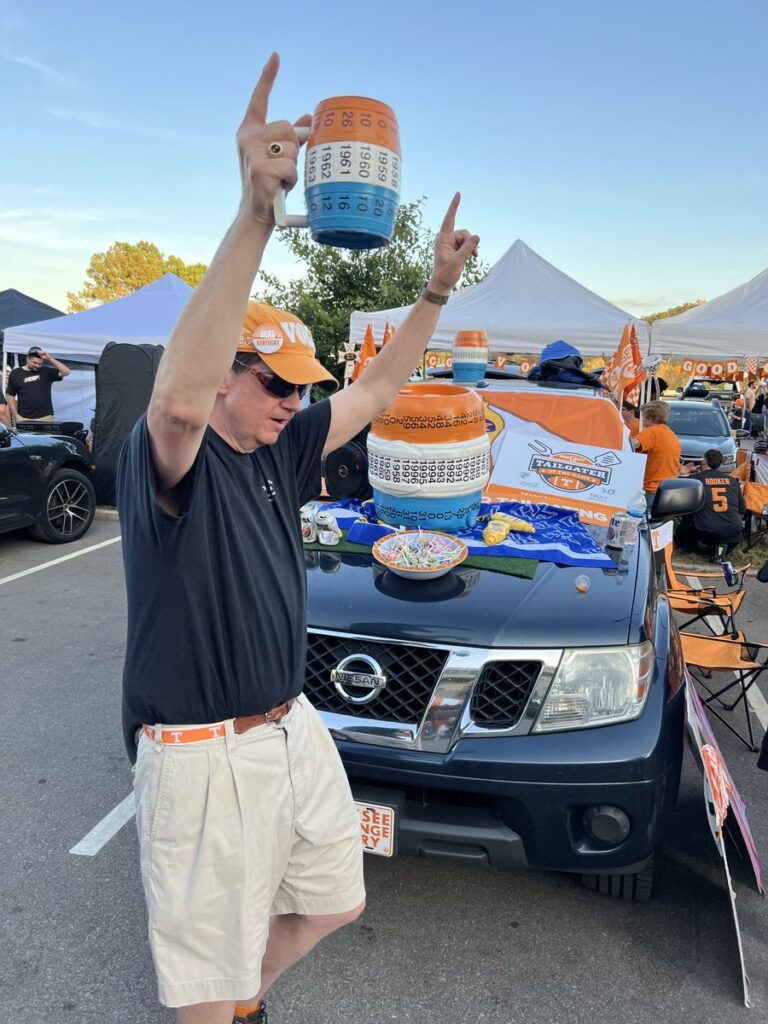 Tennessee fan with an imitation beer keg trophy