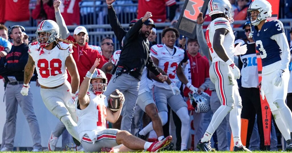 Ohio State quarterback Will Howard clinches a 20-13 win at Penn State with a late-game first down and slide. (Adam Cairns/Columbus Dispatch / USA TODAY NETWORK via Imagn Images)