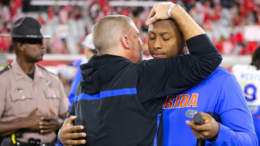 Florida Gators head coach Billy Napier gives an injured Florida Gators quarterback DJ Lagway (2) a hug after the game at EverBank Stadium in Jacksonville, FL on Saturday, November 2, 2024. The Bulldogs defeated the Gators 34-20. [Doug Engle/Gainesville Sun]