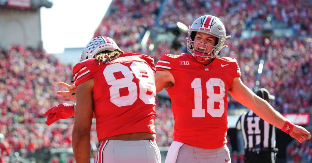 Ohio State quarterback Will Howard (right) celebrates a first quarter touchdown pass to Gee Scott Jr. (left) during a 45-0 win over Purdue in Week 11. (Samantha Madar/Columbus Dispatch / USA TODAY NETWORK via Imagn Images)