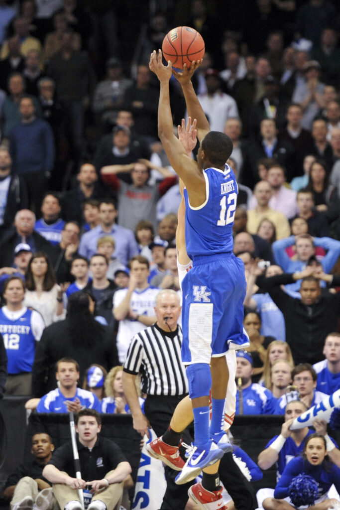 Mar 25, 2011; Newark, NJ; Kentucky Wildcats guard Brandon Knight (12) puts up the game winning shot during the second half against the Ohio State Buckeyes during the semifinals of the east regional of the 2011 NCAA men's basketball tournament at the Prudential Center. Kentucky defeated Ohio State 62-60. Mandatory Credit: Howard Smith-USA TODAY Sports