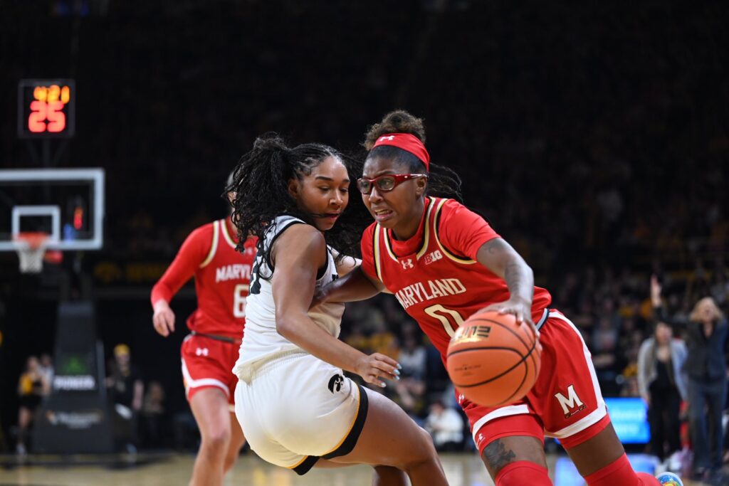 Maryland guard Shyanne Sellers drives against Iowa forward Hannah Stuelke. (Photo by Dennis Scheidt)