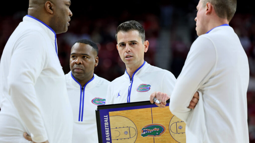 Florida Gators head coach Todd Golden talks to his assistants during the second half against the Arkansas Razorbacks at Bud Walton Arena. Florida won 71-63. (Nelson Chenault-Imagn Images)