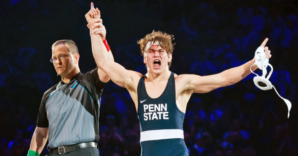 A bloodied Tyler Kasak of Penn State celebrates after defeating Iowa's Jacori Teemer 5-2 in the 157-pound bout on Friday, Jan. 31, 2025, in State College, Pa. The Nittany Lions won 30-8. (Dan Rainville / USA TODAY NETWORK via Imagn Images)