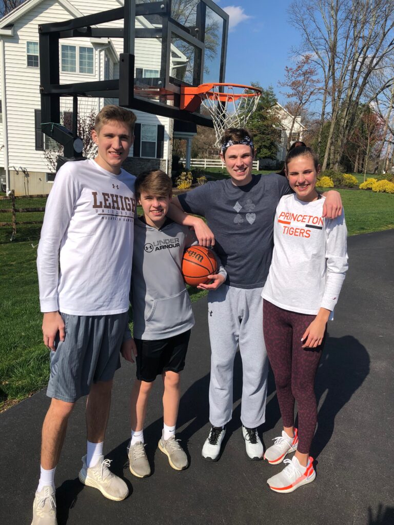 The Carr children in the driveway during a pickup game. From left to right: Andrew, Peter, Alexander, Lizzie - Photo courtesy of Phil Carr