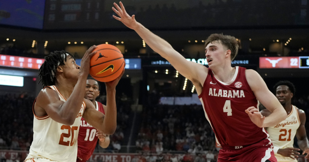 Feb 11, 2025; Austin, Texas, USA; Texas Longhorns guard Tre Johnson (20) shoots over Alabama Crimson Tide forward Grant Nelson (4) during the first half at Moody Center. Mandatory Credit: Scott Wachter-Imagn Images