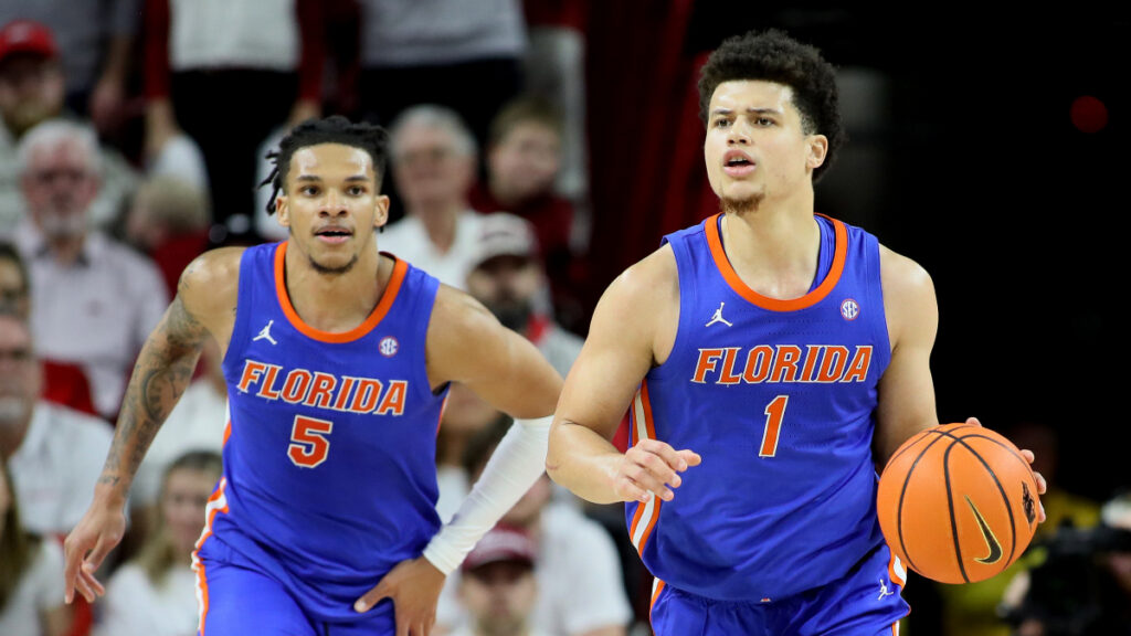 Florida Gators guard Walter Clayton Jr. (1) dribbles the ball as guard Will Richard (5) looks on during the second half against the Arkansas Razorbacks at Bud Walton Arena. Florida won 71-63. (Nelson Chenault-Imagn Images)