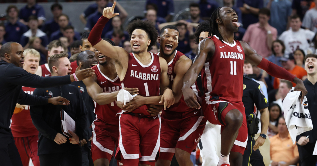 Mar 8, 2025; Auburn, Alabama, USA; Alabama Crimson Tide guard Mark Sears (1) celebrates with teammates after making the game winning shot to beat the Auburn Tigers in overtime at Neville Arena. Mandatory Credit: John Reed-Imagn Images