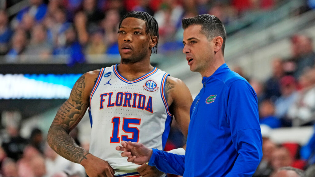 Florida Gators head coach Todd Golden and Florida Gators guard Will Richard (5) huddle up during the second half against the Connecticut Huskies in the second round of the NCAA Tournament at Lenovo Center. (Bob Donnan-Imagn Images)