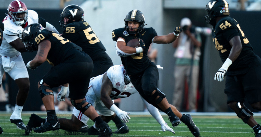 Vanderbilt Commodores tight end Eli Stowers (9) cuts through an Alabama hole for a big gain during their game at Vanderbilt Stadium in Nashville, Tenn., Saturday, Oct. 5, 2024.