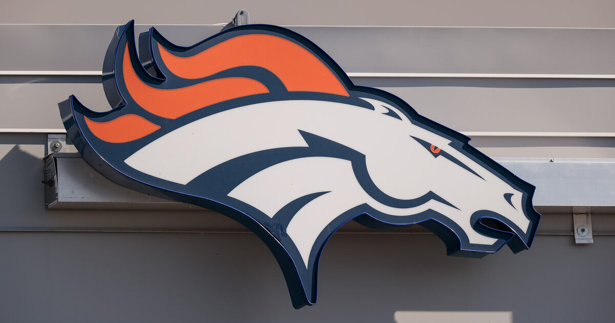 Colorado high school football team shows helmet donated by the Denver Broncos