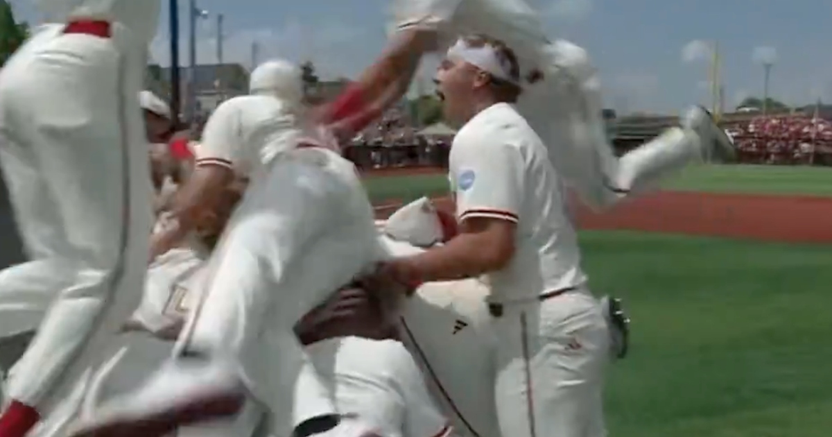 WATCH: Louisville defeats Miami, dogpiles after advancing to College World Series