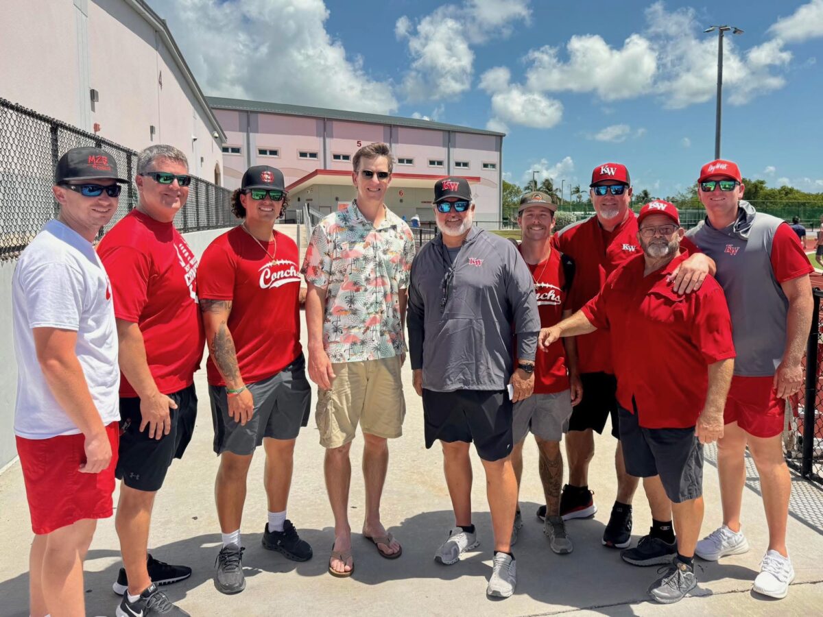 Florida high school football team's coaching staff meets Eli Manning