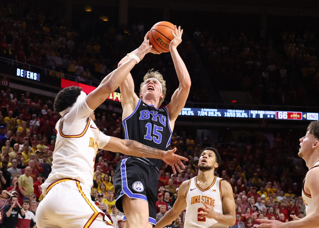 Brigham Young Cougars forward Richie Saunders (15) shoots over Iowa State Cyclones guard Tamin Lipsey (3) during the second half at James H. Hilton Coliseum. Mandatory Credit: Reese Strickland-Imagn Images