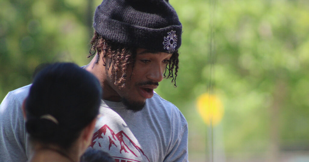 FSU QB Tommy Castellanos talks to children at Tuesday's outreach event. (Matt LaSerre/Warchant)