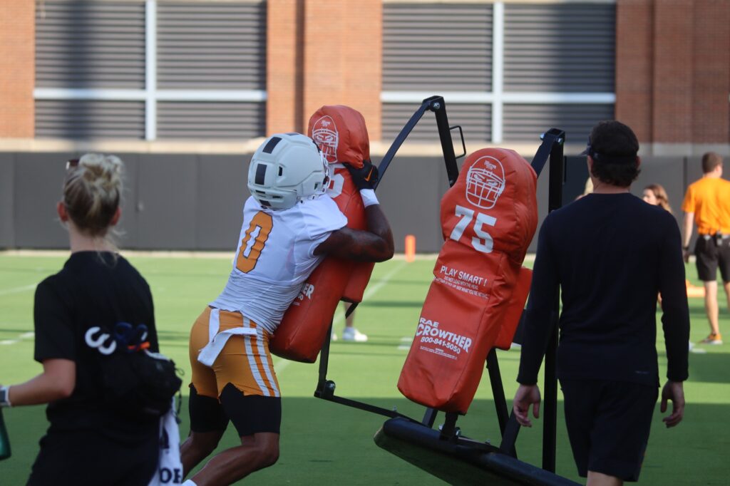 TE Ethan Davis gets in work in a sled drill