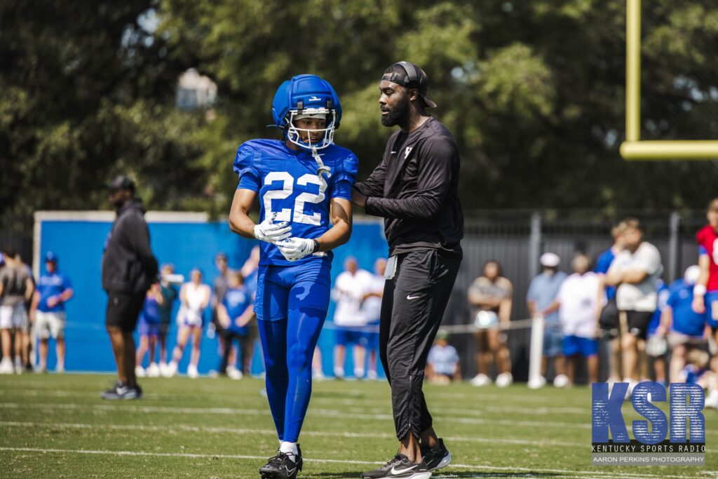 Kentucky WR coach L'Damian Washington coaches up freshman Cameron Miller at Fan Day, via Aaron Perkins, KSR