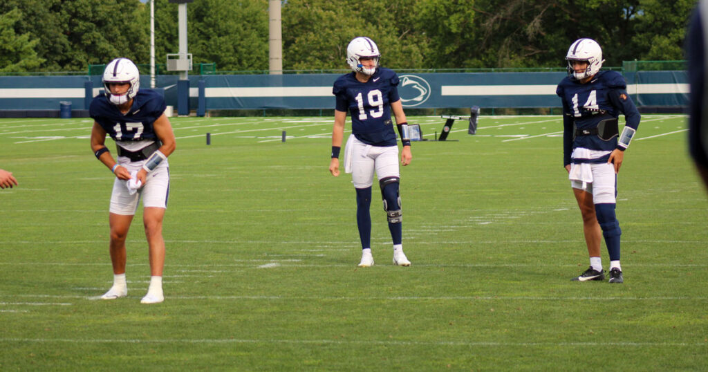 Penn State freshman quarterback Bekkem Kritza throws in the middle of fellow passers Ethan Grunkemeyer (left) and Jaxon Smolik. (Pickel/BWI)