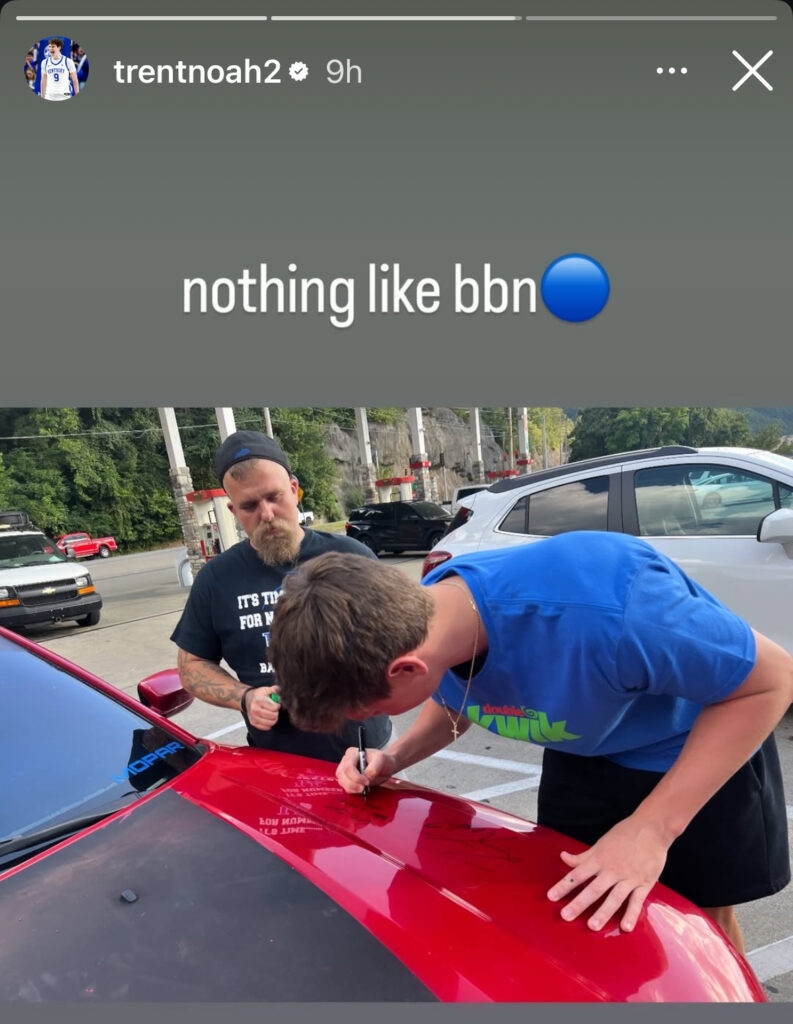 Trent Noah signs a Kentucky fan's car (trentnoah2/IG)
