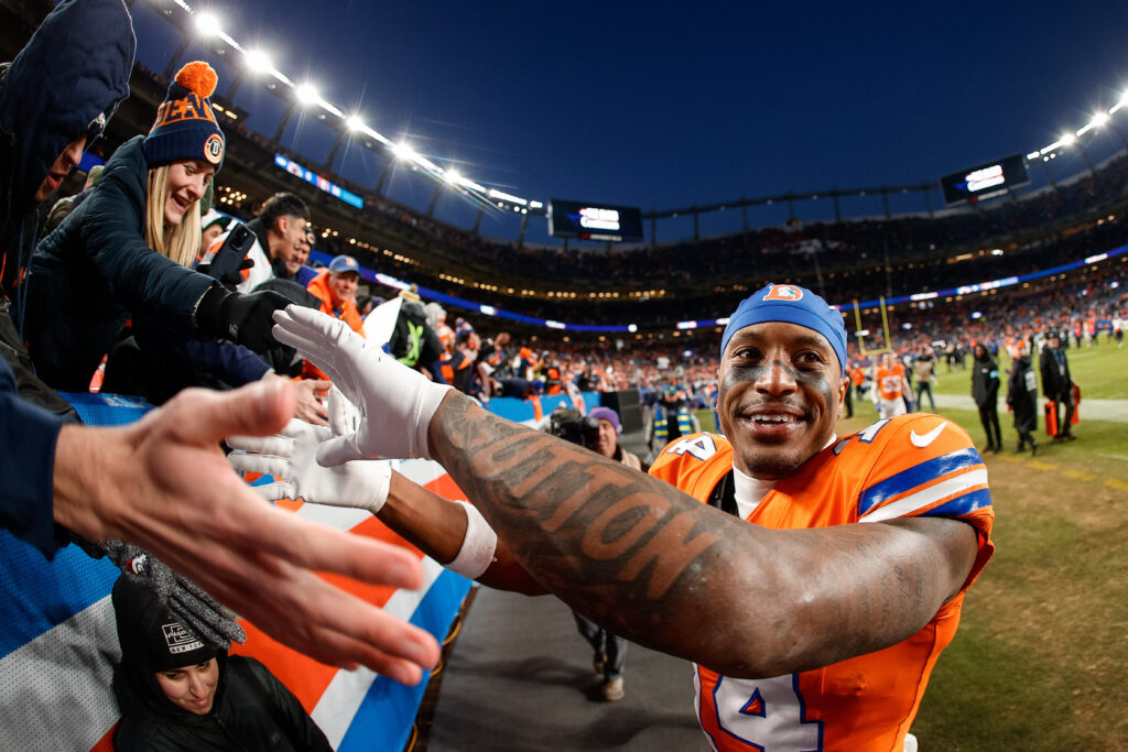 Denver Broncos wide receiver Courtland Sutton (14) celebrates with fans after the game against the Kansas City Chiefs at Empower Field at Mile High