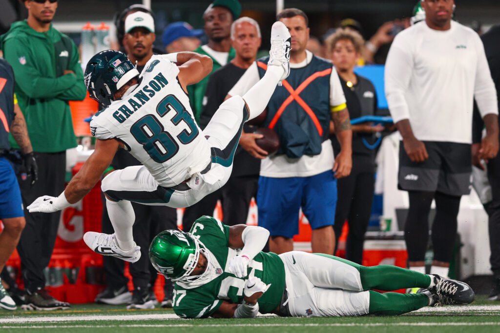 Philadelphia Eagles tight end Kylen Granson (83) is tackled by New York Jets cornerback Qwan'tez Stiggers (37) during the first half at MetLife Stadium.