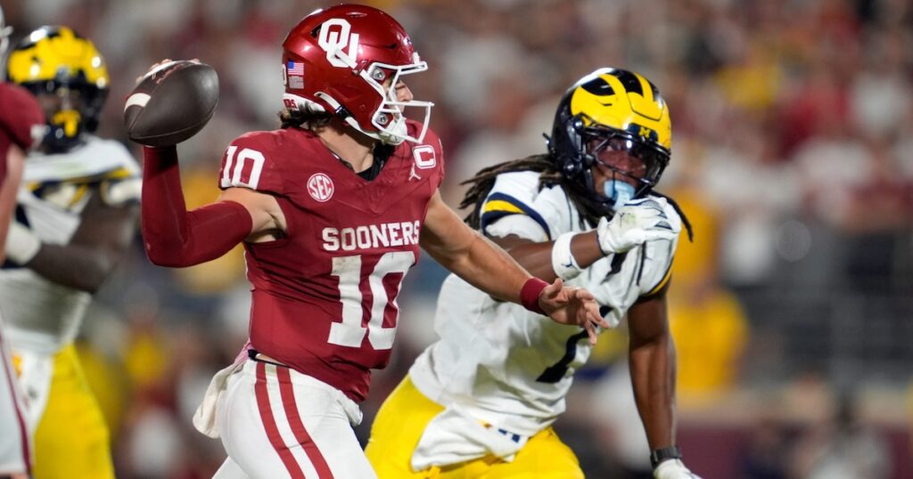 Oklahoma Sooners quarterback John Mateer (10) throws as Michigan Wolverines linebacker Jaishawn Barham (1) chases after him during a college football game between the University of Oklahoma Sooners (OU) and the University of Michigan Wolverines at Gaylord Family √ê Oklahoma Memorial Stadium in Norman, Okla., Saturday, Sept. 6, 2025. Oklahoma won 24-13. (Bryan Terry/The Oklahoman)