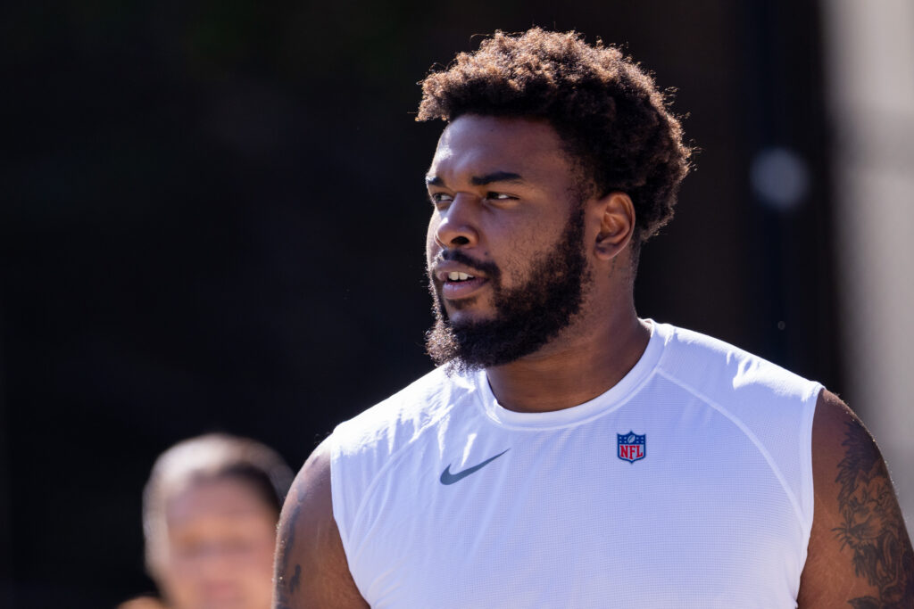 Jul 24, 2025; Charlotte, NC, USA; Carolina Panthers defensive end Jared Harrison-Hunte (75) walks to training camp. Mandatory Credit: Scott Kinser-Imagn Images