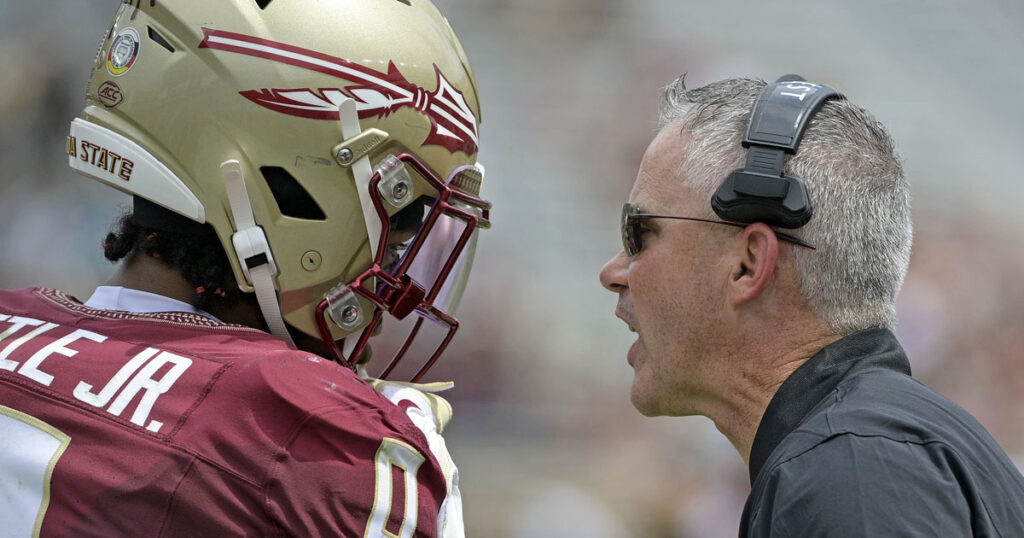 Florida State Seminoles head coach Mike Norvell speaks to safety Earl Little Jr. (0) during the second half against East Texas A&M at Doak S. Campbell Stadium. (Melina Myers-Imagn Images)