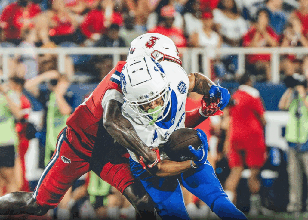 Memphis running back Greg Desrosiers breaks away from a Florida Atlantic defender.