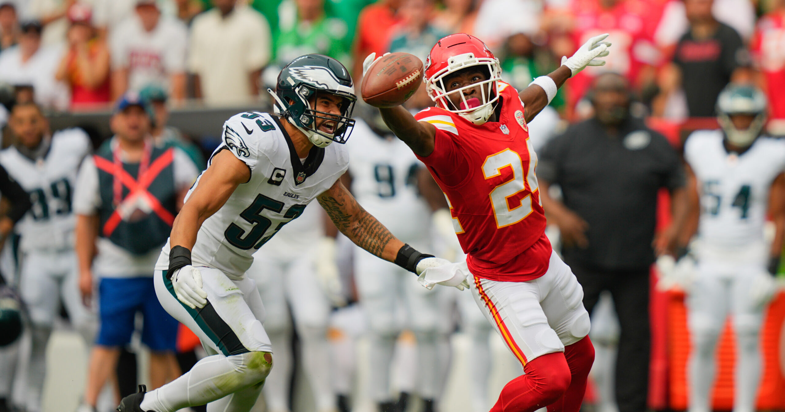 Sep 14, 2025; Kansas City, Missouri, USA; Kansas City Chiefs running back Brashard Smith (24) is unable to catch the ball defended by Philadelphia Eagles linebacker Zack Baun (53) during the first quarter of the game at GEHA Field at Arrowhead Stadium. Mandatory Credit: Jay Biggerstaff-Imagn Images