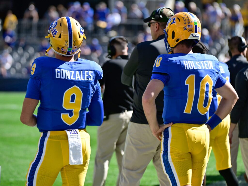Backup Pitt quarterbacks Cole Gonzales (9) and Eli Holstein (10) watch on from sidelines. Oct. 4, 2025 - Ed Thompson / PSN