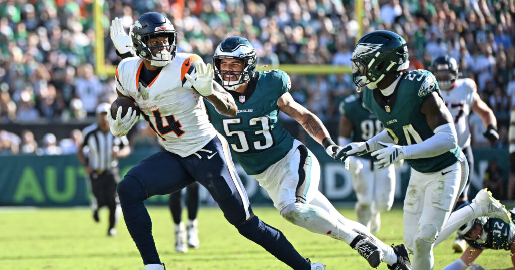 Oct 5, 2025; Philadelphia, Pennsylvania, USA; Denver Broncos wide receiver Courtland Sutton (14) runs past Philadelphia Eagles linebacker Zack Baun (53) and safety Andrew Mukuba (24) at Lincoln Financial Field. Mandatory Credit: Eric Hartline-Imagn Images