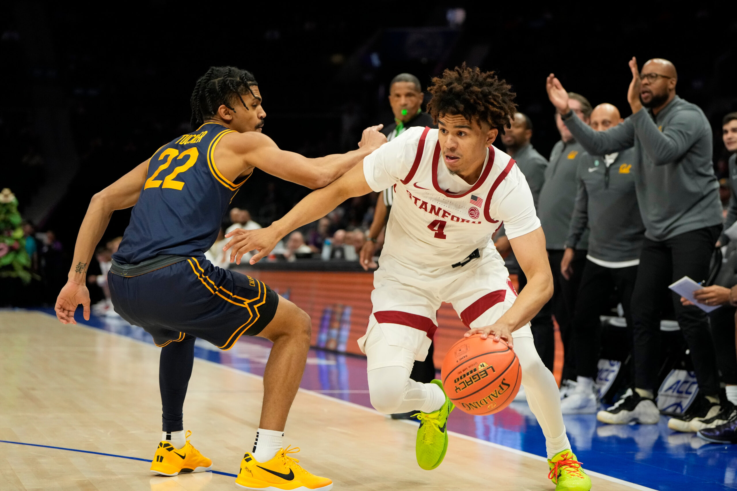 Mar 12, 2025; Charlotte, NC, USA; Stanford Cardinal guard Oziyah Sellers (4) with the ball as California Golden Bears guard Christian Tucker (22) defends in the first half at Spectrum Center. Mandatory Credit: Bob Donnan-Imagn Images