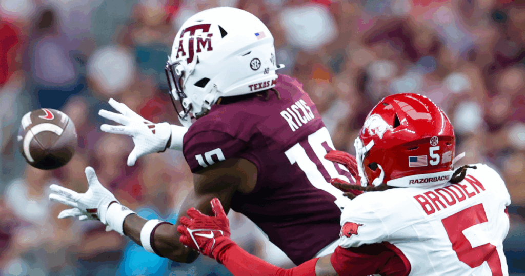 Sep 28, 2024; Arlington, Texas, USA; Texas A&M Aggies defensive back Dezz Ricks (10) intercepts a pass intended for Arkansas Razorbacks wide receiver Tyrone Broden (5) during the first half at AT&T Stadium.