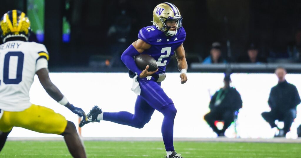 Oct 5, 2024; Seattle, Washington, USA; Washington Huskies quarterback Demond Williams Jr. (2) rushes against the Michigan Wolverines during the third quarter at Alaska Airlines Field at Husky Stadium. Mandatory Credit: Joe Nicholson-Imagn Images