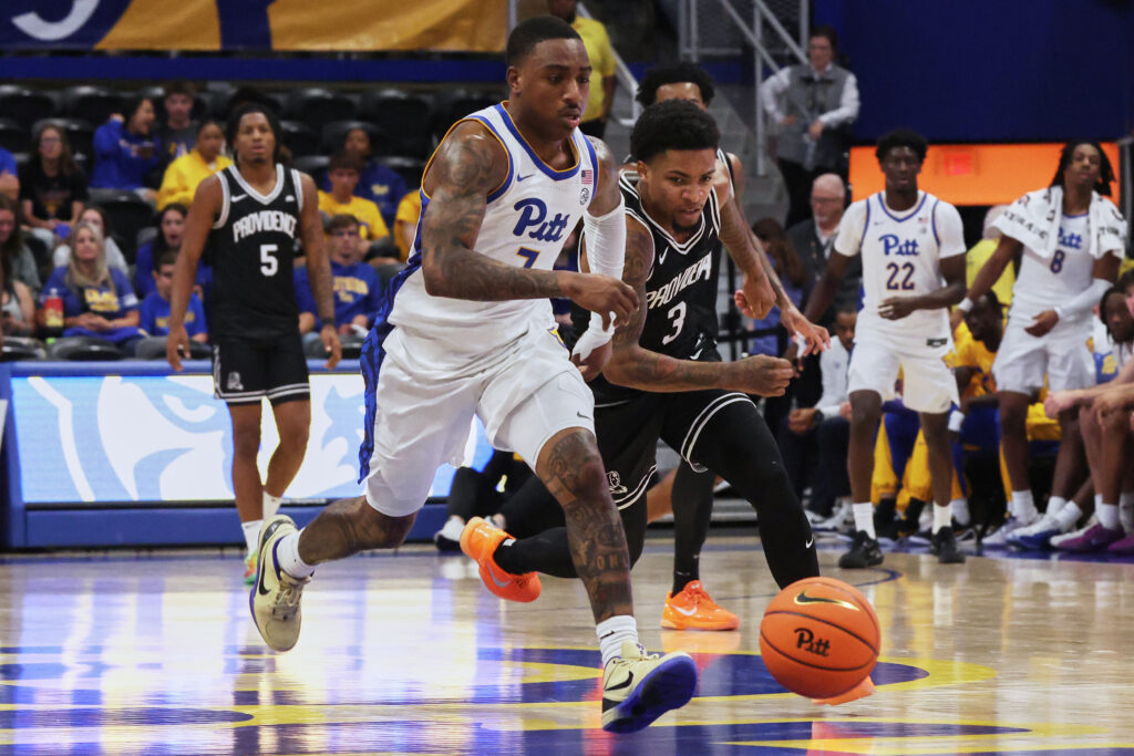 Oct 19, 2025; Pittsburgh, PA, USA; Pitt Panthers guard Damarco Minor (7) vies for a loose ball against Providence Friars guard Daquan Davis (3) during the second half at the Petersen Events Center. Mandatory Credit: Charles LeClaire-Imagn Images