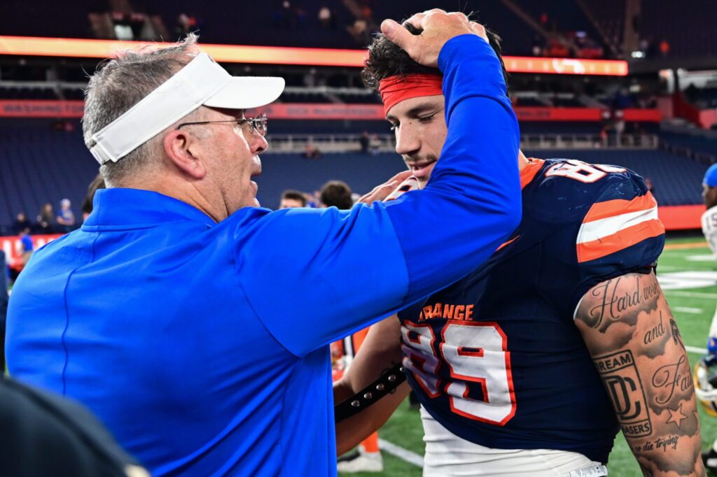 Pat Narduzzi meets with Syracuse tight end Dan Villari following a game at the JMA Wireless Dome. Oct. 18, 2025 - Ed Thompson / PSN