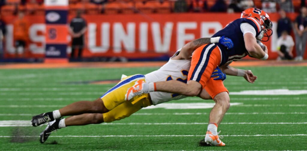 Pitt linebacker Nick Lapi tackles Syracuse quarterback Luke Carney. Oct. 18, 2025 - Ed Thompson / PSN