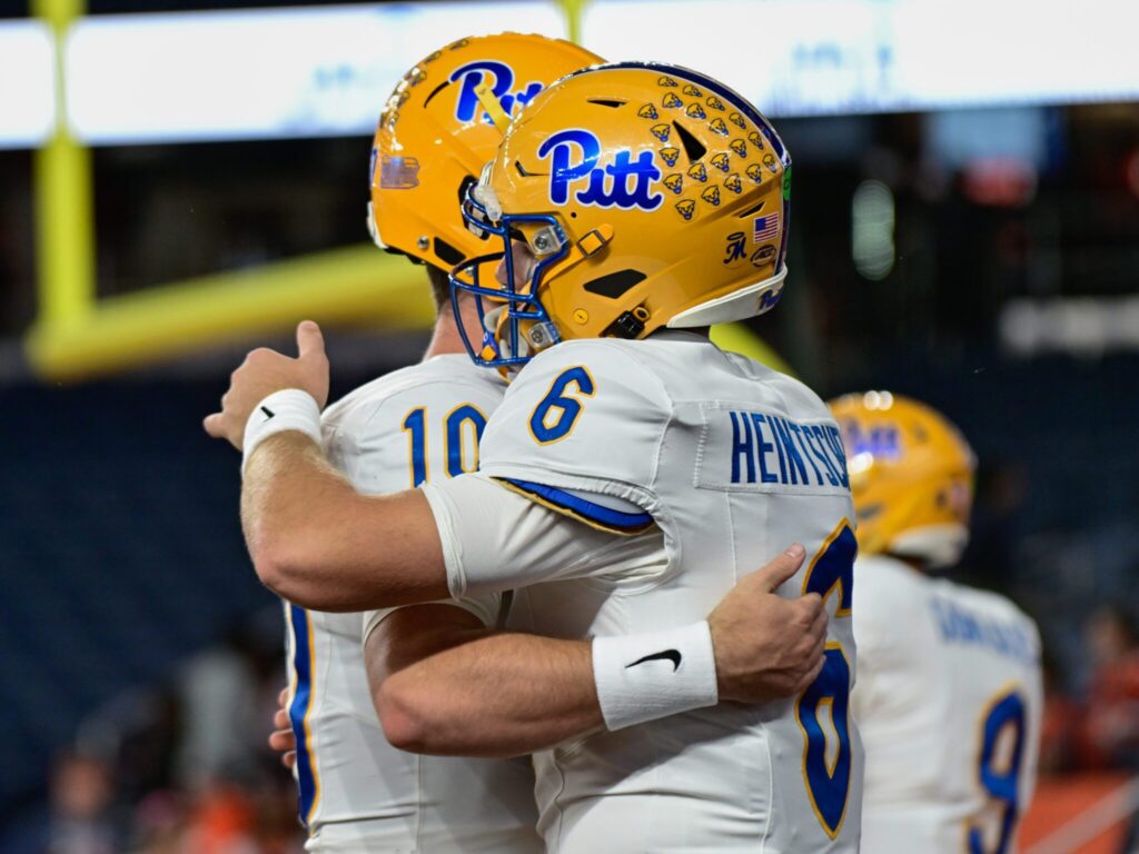 Pitt quarterbacks Eli Holstein (10) and Mason Heintschel (6) share a moment ahead of Syracuse matchup. Oct. 18, 2025 - Ed Thompson / PSN