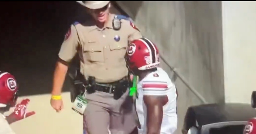 WATCH: Police officer yells at Nyck Harbor after bumping into him following touchdown