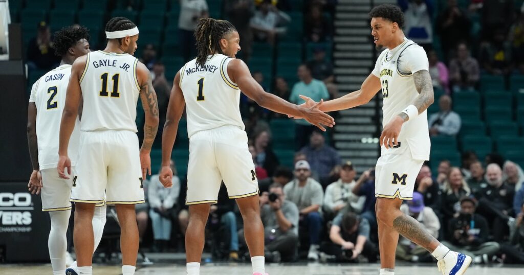 Nov 26, 2025; Las Vegas, NV, USA; Michigan Wolverines guard Trey McKenney (1) celebrates with forward Yaxel Lendeborg (23) in the second half against the Gonzaga Bulldogs in the 2025 Players Era Festival championship game at MGM Grand Garden Arena. Mandatory Credit: Kirby Lee-Imagn Images