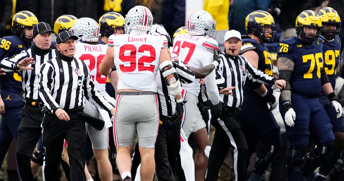 Michigan guards midfield logo after Ohio State wins The Game